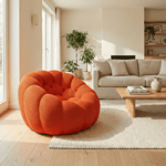 Fauteuil cocoon en tissu orange dans un salon lumineux et moderne.