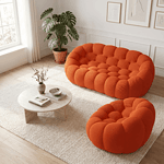 Cocon Living – Canapé et fauteuil orange Balcon cosy avec canapé et fauteuil orange.