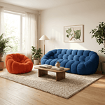 Canapé design en velours bleu et fauteuil orange dans un salon lumineux.
